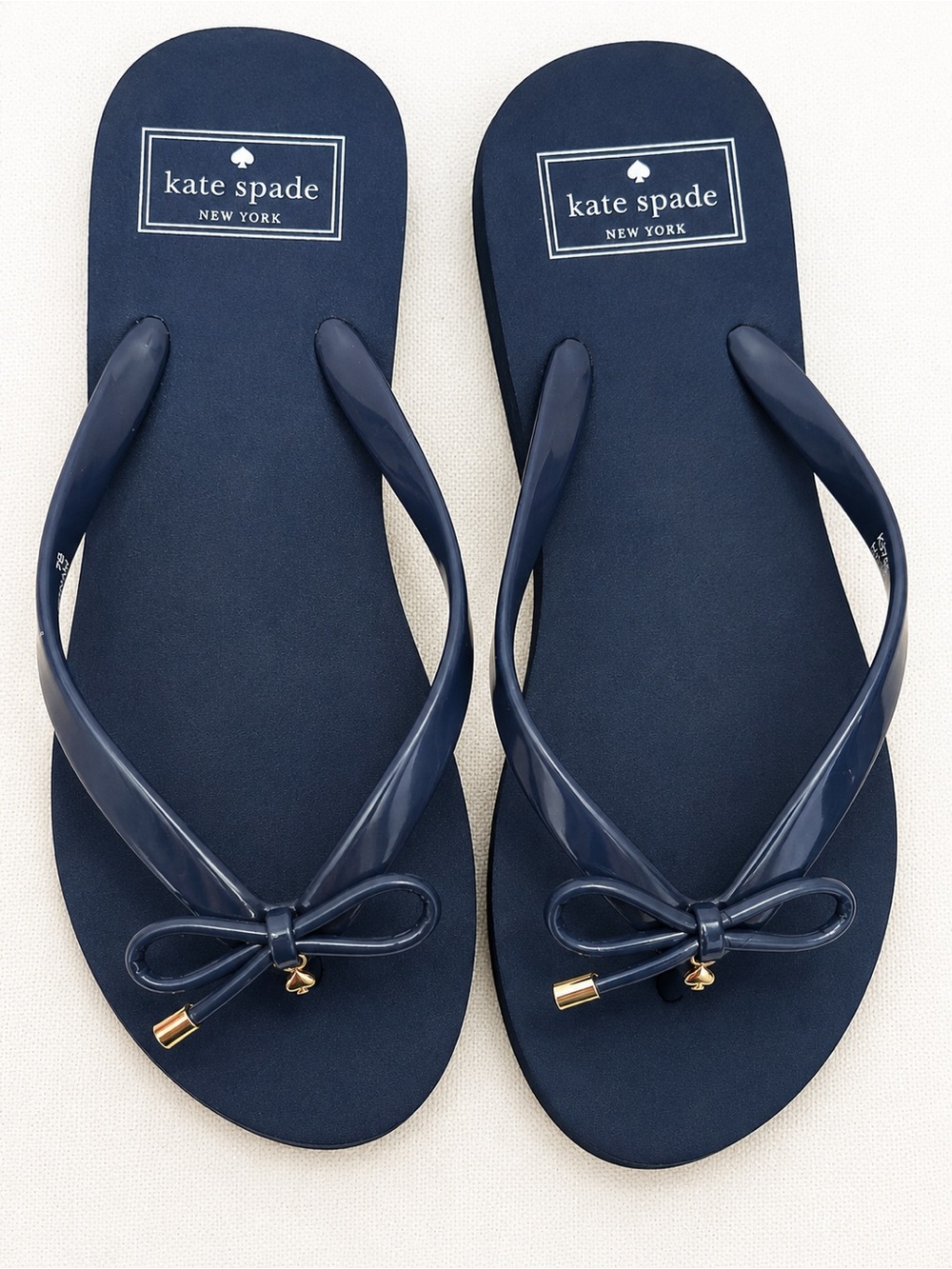 kate spade navy bow thong sandals with gold accents